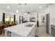 Spacious living area featuring a large kitchen island, dining table, and comfortable seating arrangement at 1620 6Th Ave, Deland, FL 32724