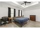 Bedroom features a ceiling fan, recessed lighting, and dark curtains to keep the room dark at 1620 6Th Ave, Deland, FL 32724