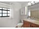 Well-lit bathroom with modern vanity and window providing natural light at 16318, 16250 & 16300 County Road 448, Mount Dora, FL 32757