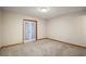 A spacious room with carpet, light walls and baseboards, and access to the outside at 16318, 16250 & 16300 County Road 448, Mount Dora, FL 32757