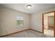 A bedroom with carpet, window, and light walls at 16318, 16250 & 16300 County Road 448, Mount Dora, FL 32757