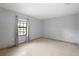 Bright bedroom with large window and neutral walls; perfect for relaxation at 16318, 16250 & 16300 County Road 448, Mount Dora, FL 32757