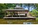 Spacious wooden boat dock on the water, featuring ample space for boat storage and water access at 16318, 16250 & 16300 County Road 448, Mount Dora, FL 32757