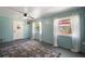 This bonus room features an exterior door, lots of natural light, and a ceiling fan at 16318, 16250 & 16300 County Road 448, Mount Dora, FL 32757