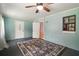 View of the bonus room, featuring large area rug, two doors, and a window at 16318, 16250 & 16300 County Road 448, Mount Dora, FL 32757