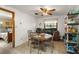 Cozy dining area features tile flooring, a ceiling fan, and room for a four-person table at 16318, 16250 & 16300 County Road 448, Mount Dora, FL 32757