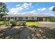 Charming single-story home with a porte cochere, complemented by mature landscaping and a well-maintained lawn at 16318, 16250 & 16300 County Road 448, Mount Dora, FL 32757
