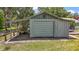 Exterior view of a garage with a covered parking area and a golf cart at 16318, 16250 & 16300 County Road 448, Mount Dora, FL 32757