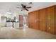 Open layout kitchen boasts white cabinetry, sleek black countertops, and modern appliances at 16318, 16250 & 16300 County Road 448, Mount Dora, FL 32757