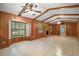 Bright living room featuring a fireplace, wood accents, tile flooring, and natural light at 16318, 16250 & 16300 County Road 448, Mount Dora, FL 32757