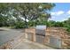 Outdoor kitchen with stainless steel grill set in a brick surround at 16318, 16250 & 16300 County Road 448, Mount Dora, FL 32757