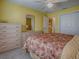This bedroom features a ceiling fan and an ensuite bathroom at 1675 Westminster Ct, The Villages, FL 32162