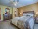 This bedroom has dark wood furniture and colorful walls at 1675 Westminster Ct, The Villages, FL 32162