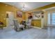 Open concept dining room adjacent to the kitchen featuring wood floors and natural light at 1675 Westminster Ct, The Villages, FL 32162