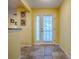 Bright foyer with neutral tile flooring and a view of the home's interior at 1675 Westminster Ct, The Villages, FL 32162
