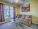 Comfortable living area with large windows offering plenty of natural light at 1675 Westminster Ct, The Villages, FL 32162