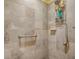 Shower featuring tile and a handheld shower head at 1675 Westminster Ct, The Villages, FL 32162