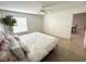 Spacious, bright bedroom with ceiling fan and tile flooring at 17483 Se 74Th Netherclift Ter, The Villages, FL 32162