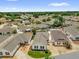 Aerial view of a community of homes with mature trees and well-maintained landscaping at 17695 Se 84Th Peyton Ct, The Villages, FL 32162