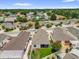 Aerial view of backyard, showing covered patio and the surrounding community at 17695 Se 84Th Peyton Ct, The Villages, FL 32162