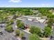 Aerial view of the Mulberry Grove Recreation Center including shuffleboard courts, pool, parking, and more at 17695 Se 84Th Peyton Ct, The Villages, FL 32162
