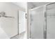 Bathroom featuring a glass-enclosed shower at 17695 Se 84Th Peyton Ct, The Villages, FL 32162