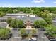Overhead view of Mulberry Grove Recreation Center and parking area surrounded by mature trees at 17695 Se 84Th Peyton Ct, The Villages, FL 32162