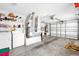 Organized garage with shelving, washer, dryer, and ample storage space at 17695 Se 84Th Peyton Ct, The Villages, FL 32162