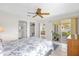 Bright main bedroom with sliding glass doors to the lanai at 17695 Se 84Th Peyton Ct, The Villages, FL 32162