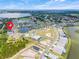 Overhead view of a residential community with a lake and pond at 1990 Wallingford Loop, Mount Dora, FL 32757