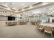 Spacious auditorium featuring tables, chairs, stage area, and ample lighting for various events at 1990 Wallingford Loop, Mount Dora, FL 32757