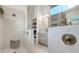 Contemporary bathroom with a walk-in shower, modern fixtures, and ample natural light at 1990 Wallingford Loop, Mount Dora, FL 32757