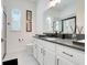 Stylish bathroom with a modern vanity, sleek fixtures, and ample natural light at 1990 Wallingford Loop, Mount Dora, FL 32757