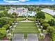 Aerial view of bocce ball courts with manicured landscaping and seating at 1990 Wallingford Loop, Mount Dora, FL 32757