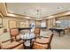Game room with multiple pool tables and seating areas at 1990 Wallingford Loop, Mount Dora, FL 32757