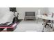 Bright home gym with a exercise bike, step platform, and work from home setup at 1990 Wallingford Loop, Mount Dora, FL 32757