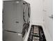 Functional laundry room with modern washer and dryer units and a stylish rug at 1990 Wallingford Loop, Mount Dora, FL 32757