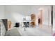 Office space with a desk, chair, shelving, and flamingo-themed powder room at 1990 Wallingford Loop, Mount Dora, FL 32757