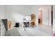 Office space featuring a desk, chair, and shelving unit with a view to another room at 1990 Wallingford Loop, Mount Dora, FL 32757