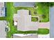 Overhead view of a home surrounded by landscaped grounds and a patio area at 2017 Palo Alto Ave, The Villages, FL 32159