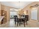 Warm dining area featuring a wooden table with seating for six and an elegant chandelier at 2017 Palo Alto Ave, The Villages, FL 32159