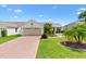 Charming single Gathering home with well manicured landscaping and an attached two car garage at 2017 Palo Alto Ave, The Villages, FL 32159