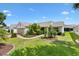 Charming single Gathering home with well manicured landscaping, walkway, and attached two car garage at 2017 Palo Alto Ave, The Villages, FL 32159