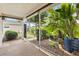 Relaxing lanai surrounded by lush landscaping and a serene outdoor view at 2017 Palo Alto Ave, The Villages, FL 32159