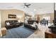 Comfortable living room seamlessly connected to the dining area and kitchen, perfect for modern living at 2017 Palo Alto Ave, The Villages, FL 32159