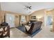 Cozy living room featuring an open floor plan, vaulted ceilings, and neutral finishes at 2017 Palo Alto Ave, The Villages, FL 32159