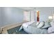 Relaxing bedroom with a plush bed, ceiling fan, and ensuite bathroom access at 2017 Palo Alto Ave, The Villages, FL 32159