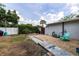 Backyard featuring stone features, a lawn, privacy fence, and a chair at 212 Blossom Ln, Winter Park, FL 32789