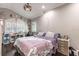 Tranquil bedroom featuring vaulted ceilings, wood floors, and natural light from the window at 212 Blossom Ln, Winter Park, FL 32789