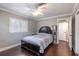 Bedroom features hardwood floors, a ceiling fan, and natural light from the window at 212 Blossom Ln, Winter Park, FL 32789